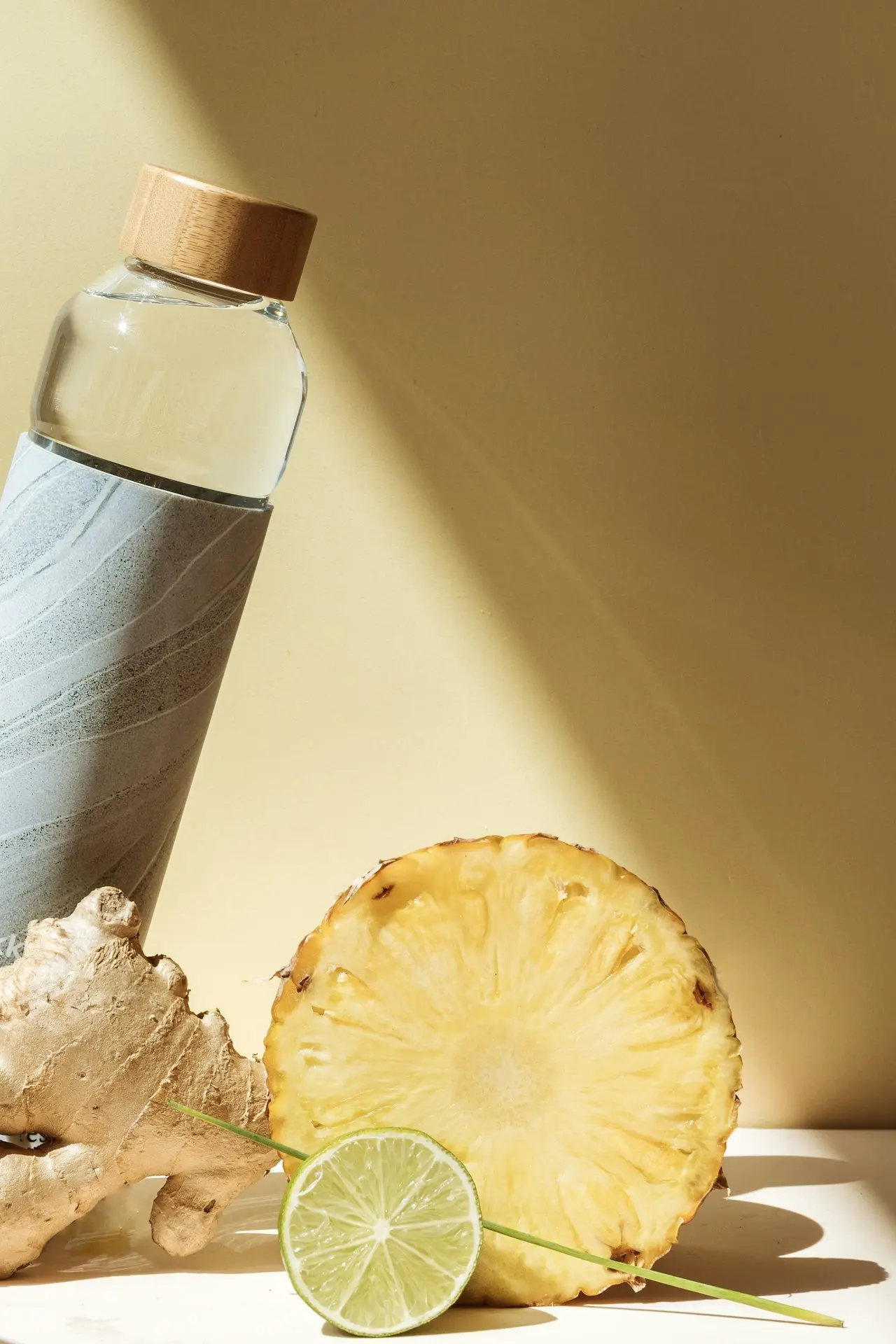 stainless steel bottle with sliced lemon and white liquid